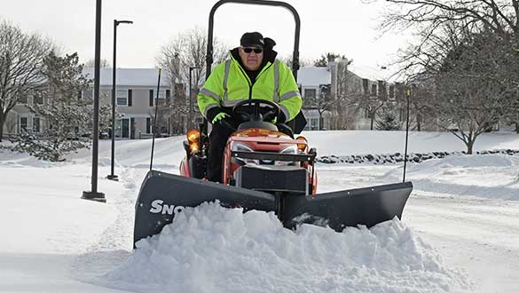 heavy-duty utv plow on sub-compact tractor